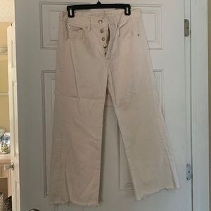 High waisted Cream wide legged ankle jeans with natural fraying